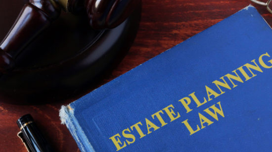 Book with title estate planning law and a gavel.