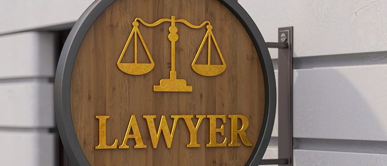 Lawyer Sign on Building's Wall. Law Office